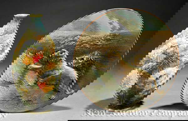 Japanese "Nippon" Relief-Decorated Plate and Vase: A Japanese "Nippon" Relief-Decorated Plate and Vase, the plate molded with lions in relief, base marked "Hand Painted Nippon" with green maple leaf; the vase relief-decorated with sunflowers and leafy