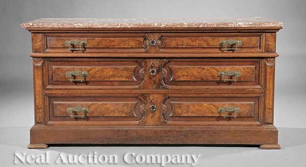 American Renaissance Burled Walnut Chest of Drawe: An American Renaissance Burled Walnut Chest of Drawers, late 19th c., marble top above three paneled drawers with incised carving, molded base, blocked feet, height 27 3/8 in., width 54 7/8 in., depth