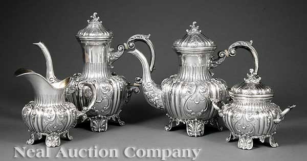 Italian @.800 Silver Coffee and Tea Service: An Italian .800 Silver Coffee and Tea Service, Vallè Mario Snc di Vallè Carlo e Alberto, Milan, ret. F.lli Peruzzi, Florence, comprised of a coffee pot, teapot, covered sugar and creamer, ornate lon