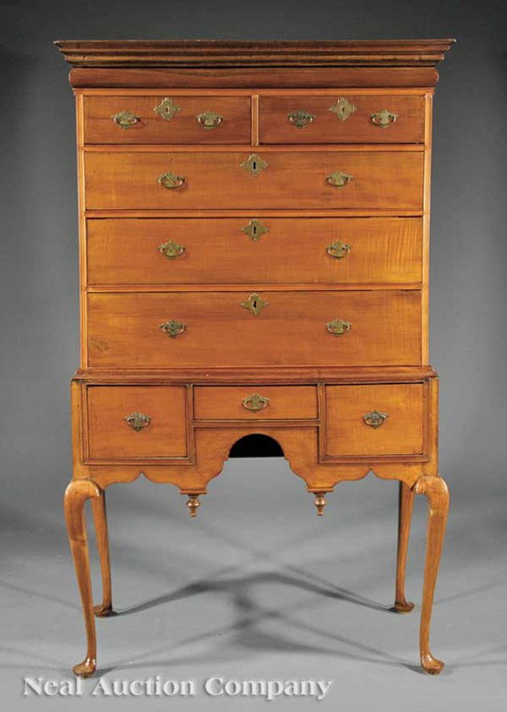 American Queen Anne Maple Highboy: An American Queen Anne Maple Highboy, 18th c., Massachusetts, stepped molded cornice with concealed map drawer, two over three graduated drawers; the lower case with short drawer flanked by deep drawe