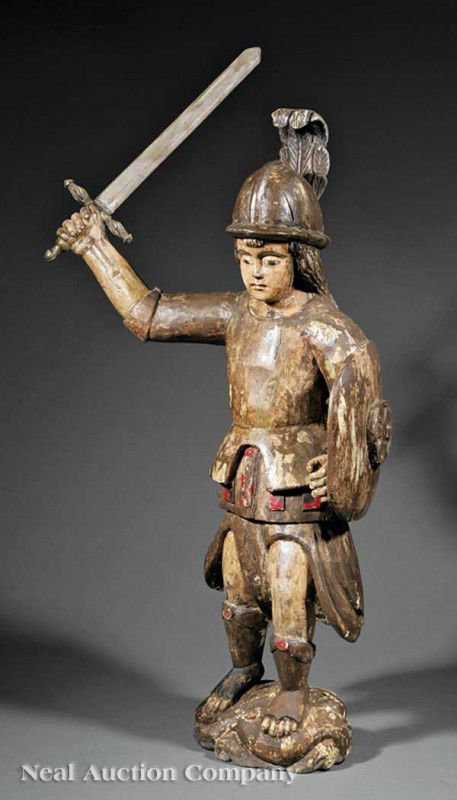 Carved Polychromed Wood Figure of St. Michael: A Spanish Colonial Carved and Polychromed Wood Figure of St. Michael, 18th c., with raised sword and shield, height 36 in., width 16 1/4 in., depth 10 in.
