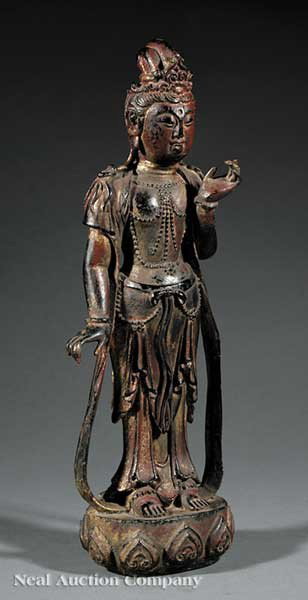Chinese Gilt and Polychrome Decorated Bronze Guan: A Chinese Gilt and Polychrome Decorated Bronze Figure of Guanyin, 19th c., cast standing upright upon a lotus pod base, wearing waisted skirts and a long shawl which drapes down the shoulders over vol