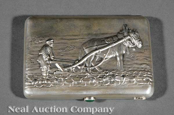 A Russian Silver Cigarette Case, 84 zolotnik: A Russian Silver Cigarette Case, Moscow, 84 zolotnik mark, 1908-1917, the embossed cover depicting a man and a horse plowing a field, oxidized exterior, gilt interior and applied green stone catch, ma
