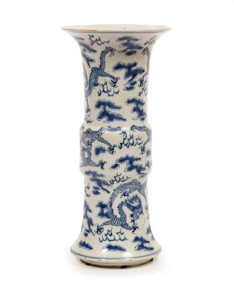 Chinese Blue and White Porcelain Gu Vase: Chinese Blue and White Porcelain Gu Vase, decorated with dragons pursuing the flaming pearl, base with double ring mark, h. 13 7/8 in. Note: losses