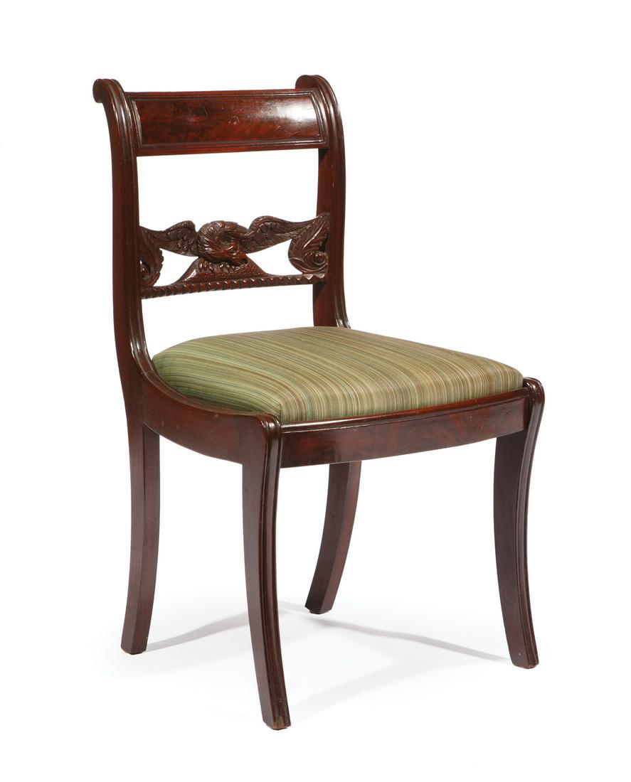 American Classical Carved Mahogany Child's Chair: American Classical Carved Mahogany Child's Chair, early 19th c., New York, in the manner of Duncan Phyfe, carved spreadwing eagle slat, slip seat, sabre legs, h. 30 1/2 in., w. 17 3/4 in., d. 16 in. .