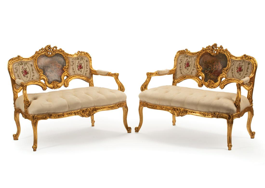 Pair of Louis XV-Style Carved Giltwood Canapes: Pair of Louis XV-Style Carved Giltwood Canapes, serpentine back centered with panel of a court scene, cabriole legs, h. 34 1/2 in., w. 44 1/2 in., d. 21 in