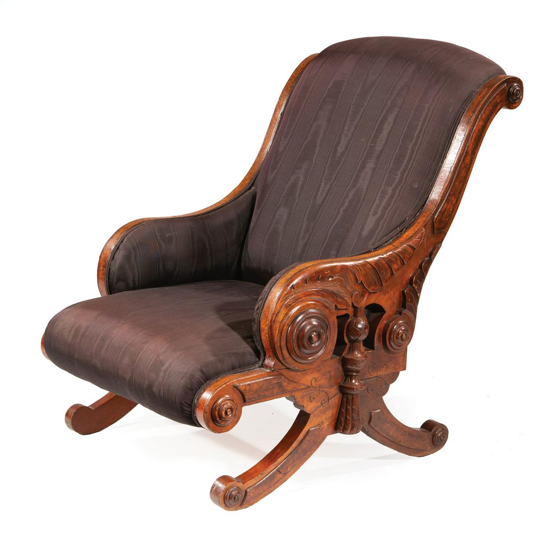 American Aesthetic Burl Walnut Armchair: American Aesthetic Burl Walnut Armchair, late 19th c., scrolled back, highly carved returns, acanthine and tassel motif, scrolled trestle base, h. 36 1/2 in., w. 26 1/2 in., d. 32 in. Provenance: Brem