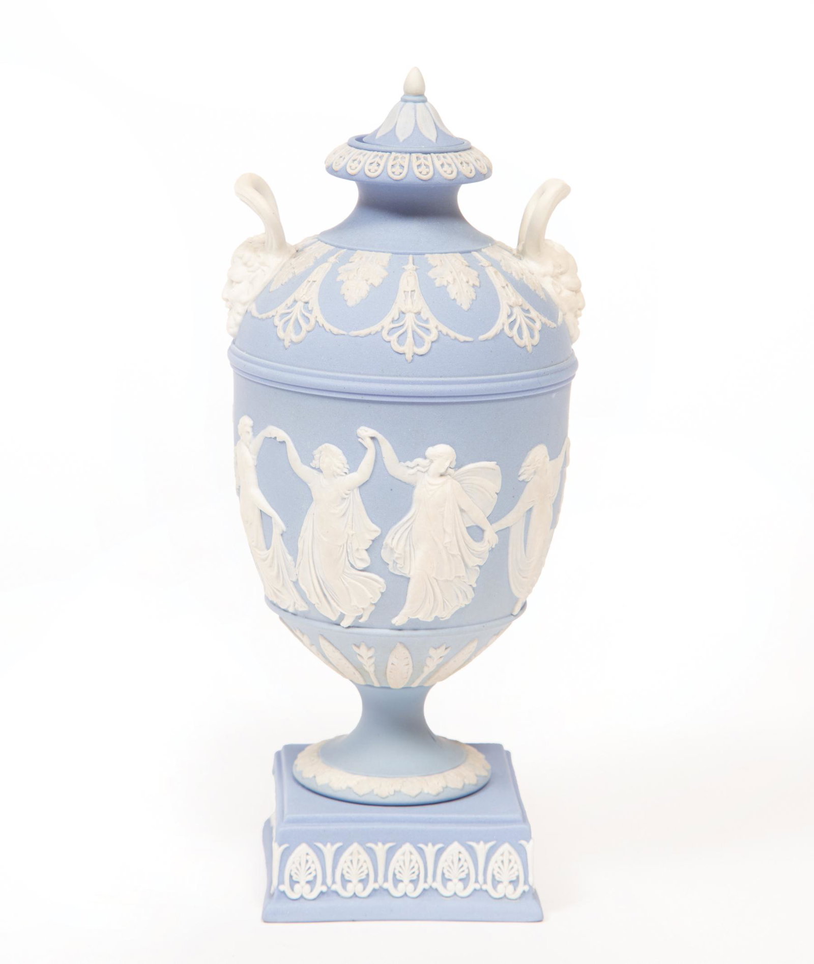 Wedgwood Blue Jasperware Covered Urn: Wedgwood Blue Jasperware Covered Urn, late 18th/early 19th c., impressed mark, frieze of dancing women, figural head handles, h. 7 in.