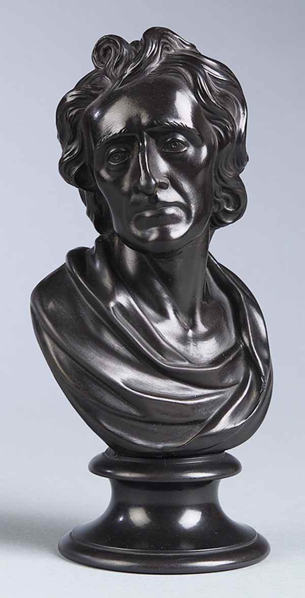 Wedgwood Black Basalt Bust John Wesley: A Wedgwood Black Basalt Bust of John Wesley , c. 1800, impressed "Wedgwood" on base, the figure depicted in classical drape and set upon a waisted circular base, height 8 in., width 4 in., depth 3 in*