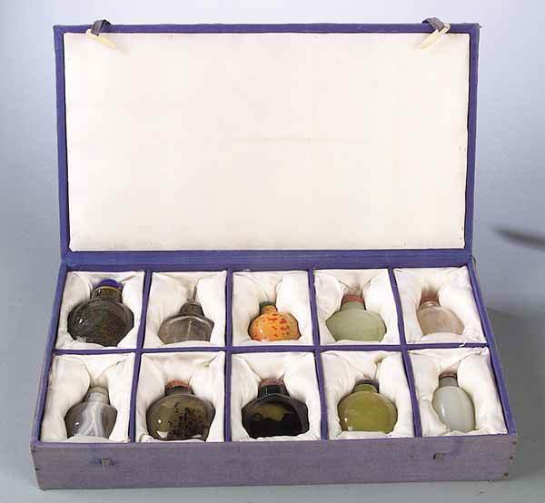 A Collection of Ten Snuff Bottles: A Collection of Ten Snuff Bottles , mid-20th c., various stones including quartz, jade and agate, a few with carved decoration, in a fitted satin-lined box, 8 1/2 in. x 15 1/4 in* NO RETURNS ARE ACCEP