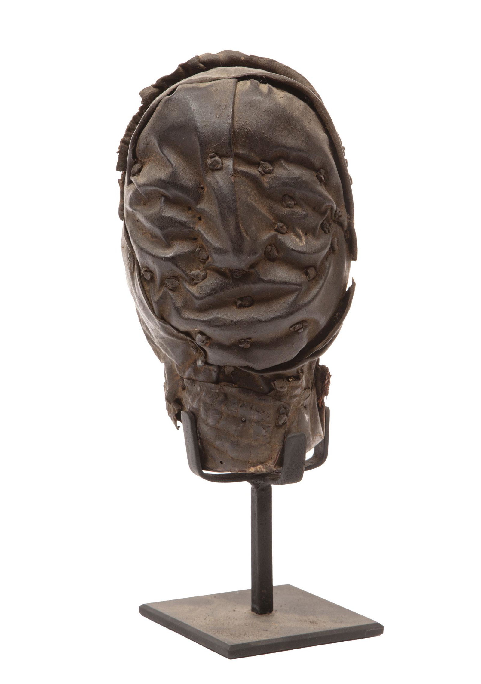 African Keaka Head: African Keaka Head, Cameroon near Nigerian border, wood, reptile hid, animal skin, fiber and iron nails, h. 8 1/2 in., w. 5 in., d. 5 in.; on metal stand, overall h. 12 3/4 in. Provenance: Gift of Fra