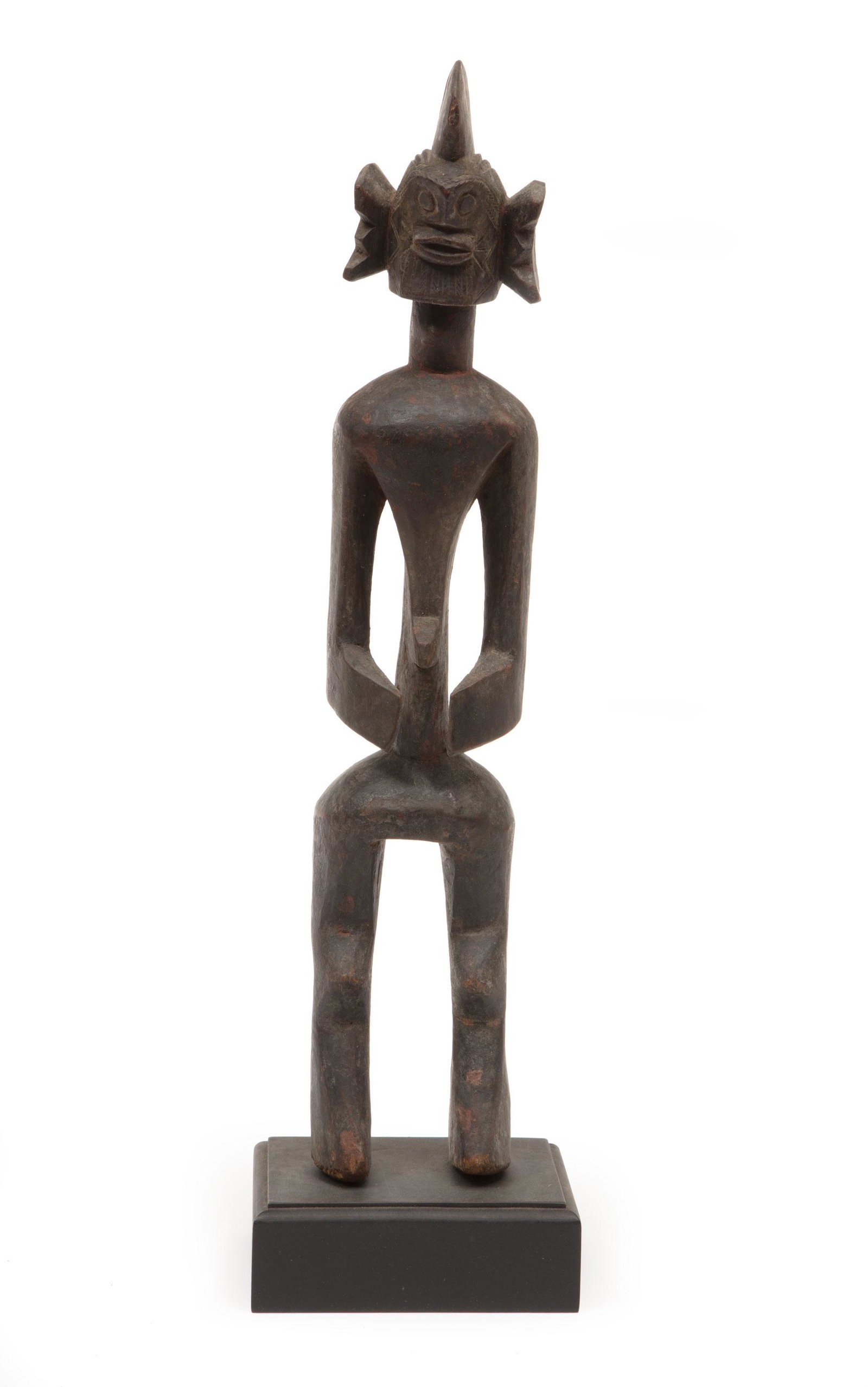 African Mumuye Carved Wood Figure: African Mumuye Carved Wood Figure, Nigeria, incised geometric designs, h. 18 3/4 in., w. 3 1/4 in., d. 3 in.; mounted on wood stand, overall h. 20 1/2 in. Provenance: Estate of Curator and Scholar and