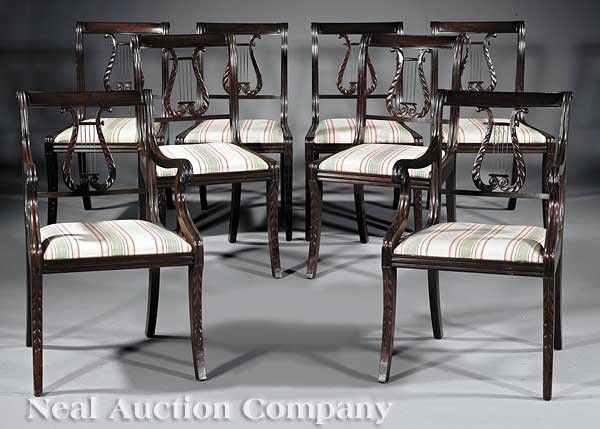 Eight American Carved Mahogany Dining Chairs: A Set of Eight American Finely Carved Mahogany Dining Chairs, in the style of Duncan Phyfe, comprising 6 side and 2 armchairs, with paneled tablet crests, molded stiles, acanthus-carved lyre backs wit