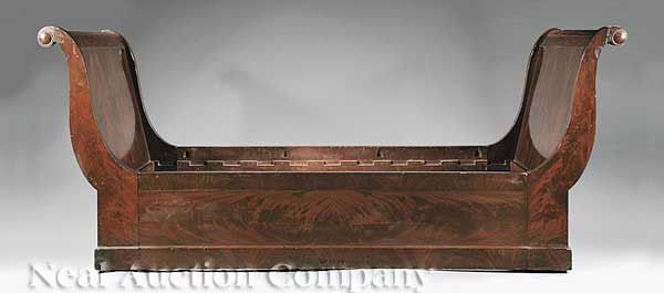 American Restauration Lid de Repos: An American Restauration Lid de Repos, New York, in the manner of Duncan Phyfe, ornate brass casters beneath a plinth base, deep skirt, scroll head and foot ending in convex boss, height 41 in., lengt