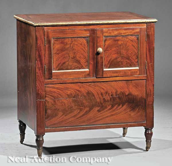 American Federal Brass-Mounted Mahogany Commode: An American Federal Brass-Mounted Mahogany Commode, early 19th c., New York, School of Duncan Phyfe, lift top, brass molding, interior well with original pewter convenience pot; two lower brass molded