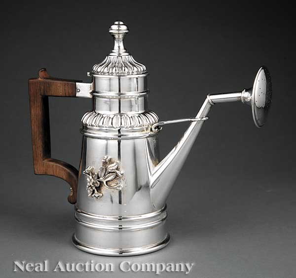Continental Sterling Silver Watering Can: A Continental Sterling Silver Watering Can, Italy, 20th c., tapered cylindrical form with gadrooned shoulders and hinged cover, molded bands, tapered angular spout and rosewood handle, height 9 3/4 in