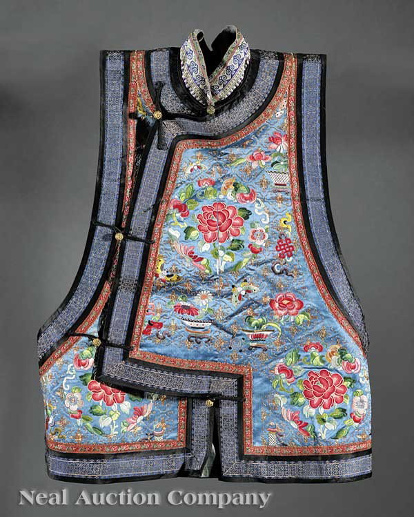 Chinese Embroidered Silk Vest: A Chinese Embroidered Silk Vest, late 19th c., the heather blue silk embroidered with floral and auspicious emblem designs worked in satin and knot stitch with couched gold thread highlights, height 2