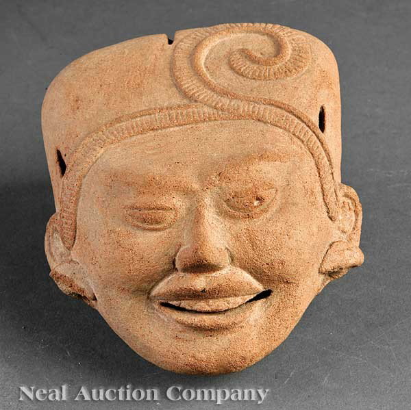 Pre-Columbian Pottery "Sonriente" Head: A Pre-Columbian Pottery "Sonriente" Head, Veracruz, realistically modeled smiling face, with a flattened brow line extending into a pierced rectangular coiffure with raised scrolling ribbon design, he