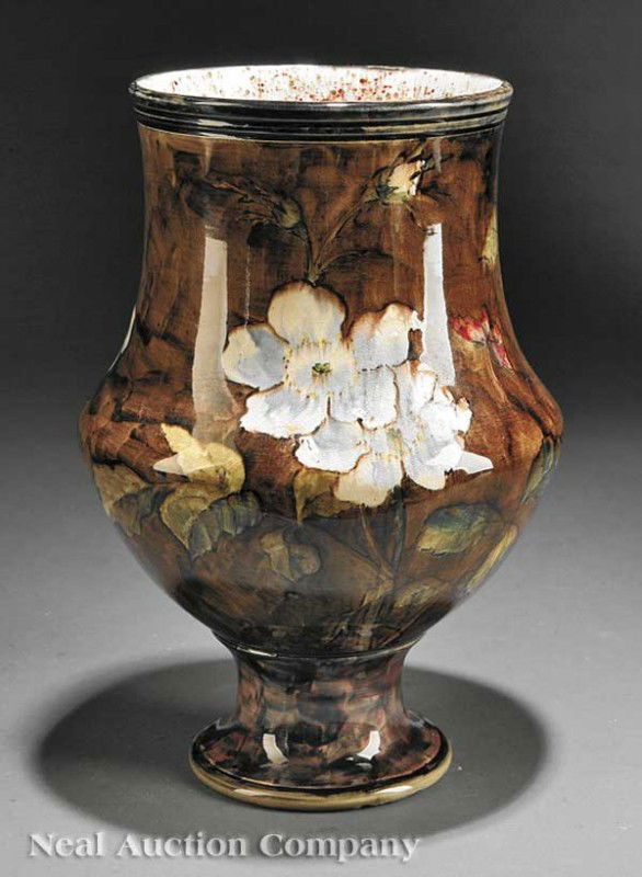 John Bennett Pottery Lamp Base: A John Bennett Pottery Lamp Base, late 19th c., marked with conjoined "GR" in brown underglaze, slip decorated with camellias on a brown ground, height 11 3/4 in