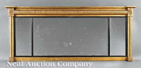 Classical Carved Gilded Overmantel Mirror: An American Classical Carved and Gilded Overmantel Mirror, c. 1820, bolection molded frame with rosette corner blocks, tripartite mirror plate with ebonized reeded liners, height 23 in., width 56 1/2 