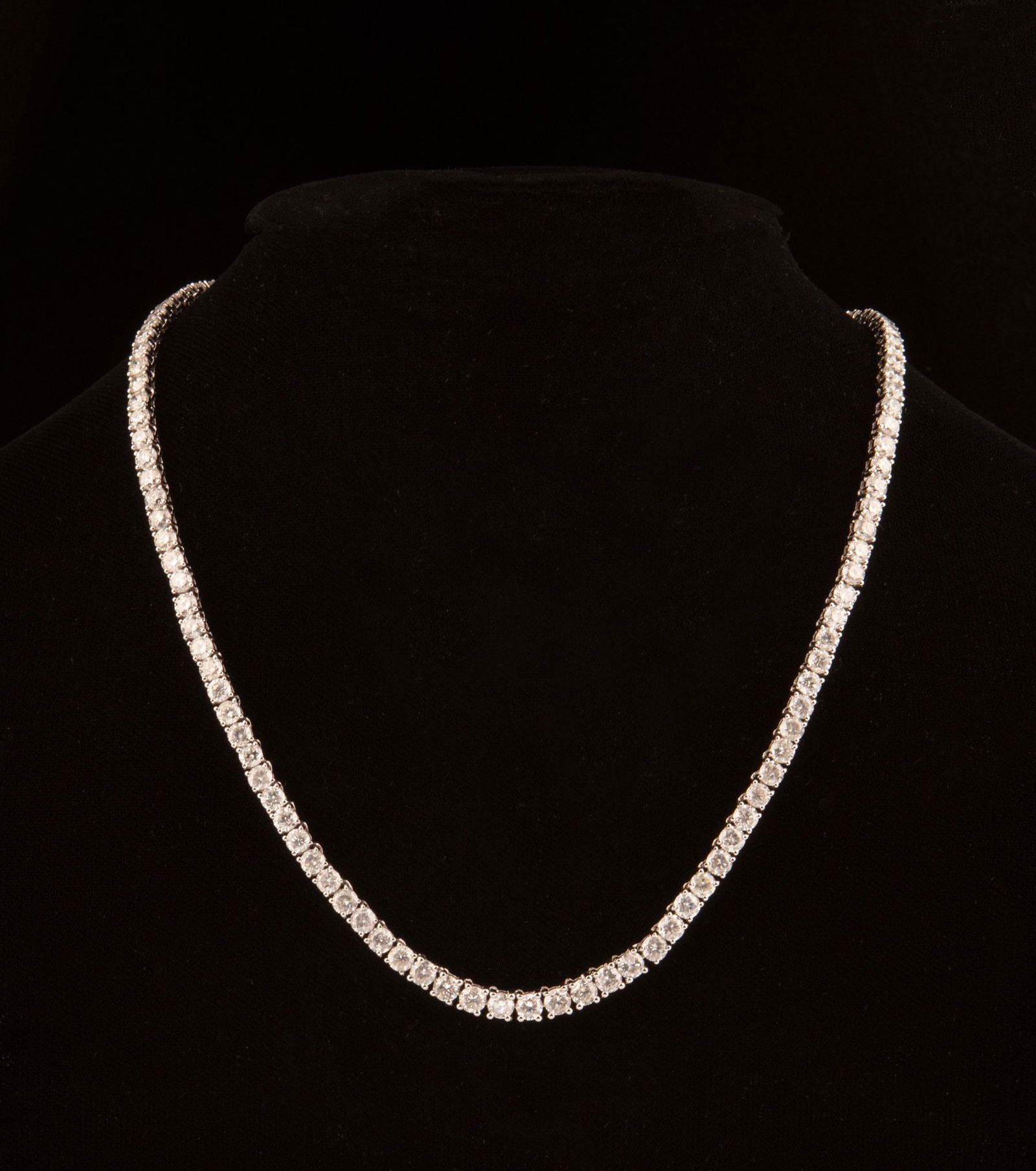 18 kt. White Gold and Diamond Necklace: 18 kt. White Gold and Diamond Necklace, mounted with 115 round brilliant-cut diamonds, total wt. approx. 23.01 cts., 3.40-4.00 mm, H-K color, SI1 to I1 clarity; finished with tension lock clasp and do