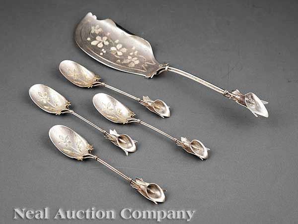 Whiting Sterling Silver Ice Cream Set: An American Aesthetic Sterling Silver Ice Cream Set, late 19th/early 20th c., Whiting Manufacturing Company, act. 1866-1926, Calla lily motif, including an ice cream slice, length 11 7/8 in.; and four