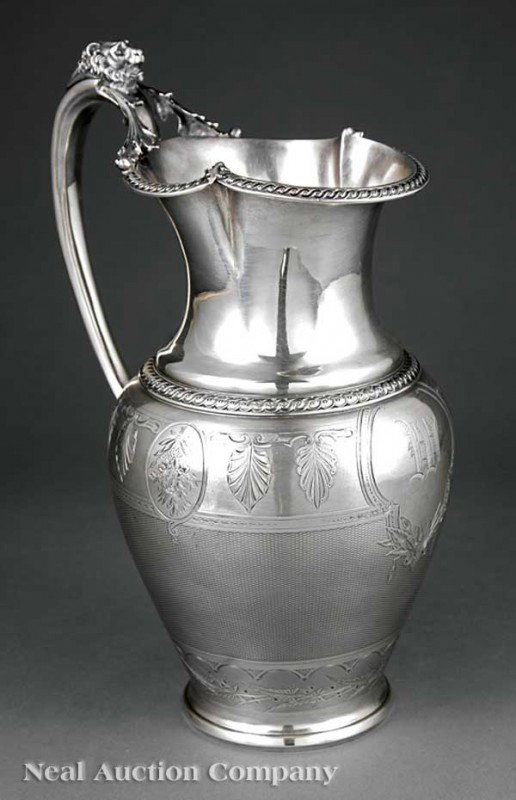 Gorham Coin Silver Water Pitcher: A Fine American Coin Silver Water Pitcher, c. 1859, Gorham Manufacturing Company, Providence, est. 1831, retailed by J. E. Caldwell and Co., Philadelphia, est. 1839, scroll handle surmounted by lion's