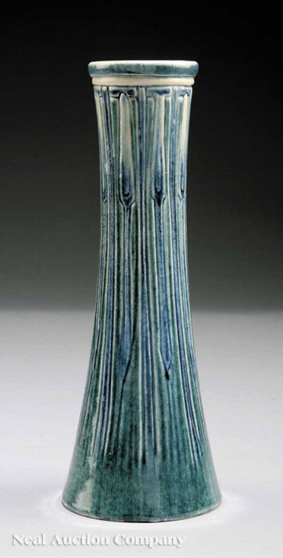 Newcomb College Art Pottery High Glaze Vase: A Newcomb College Art Pottery High Glaze Vase, 1908, decorated by Marie Levering Benson with an incised floral bud design in blue and green underglaze, base marked with Newcomb cipher, decorator's mar