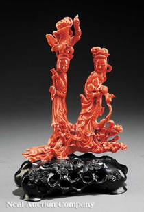 Chinese Carved Coral Figural Group Two Beauties: A Chinese Carved Coral Figural Group of Two Beauties, the elegantly attired figures carved standing upon a flowering prunus branch with frolicking rabbits at their feet, one figure with a bottle vase