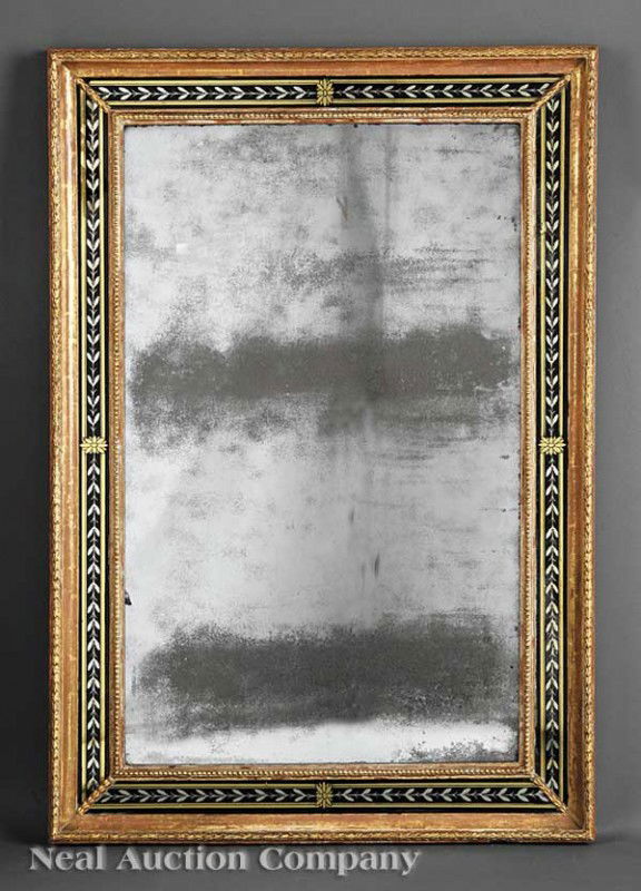 Carved Giltwood and Eglomise Looking Glass: An Antique Continental Carved Giltwood and Eglomise Looking Glass, early 19th c., foliate-carved frame with laurel leaf eglomise inner border surrounded by beaded molding, height 39 1/4 in., width 27