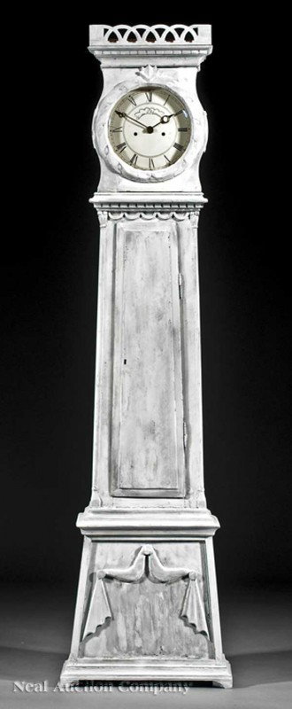 Scandinavian Carved and Painted Tallcase Clock: An Antique Scandinavian Carved and Painted Tallcase Clock, 19th c., pierced gallery, dial window with carved floral border, tapering case with drapery, striking bell movement, height 79 1/2 in., width