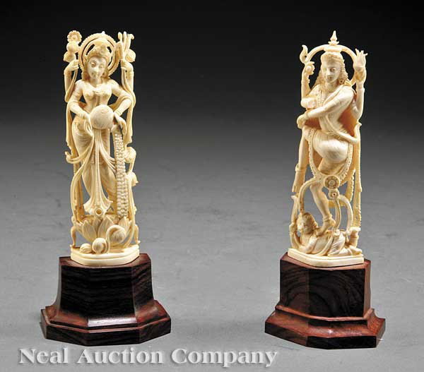 Two Indian Carved Ivory of Lakshmi and Saraswati: Two Indian Carved Ivory Figures of Lakshmi and Saraswati, each four-armed Hindu goddess carved standing, Lakshmi on a lotus pod and Saraswati on a crouching figure, height 5 in. and 5 1/8 in., mounted