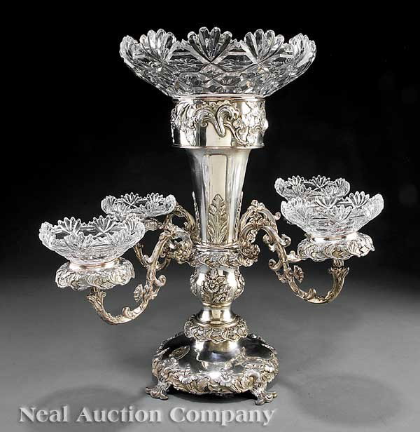 English Silverplate Epergne: An Antique English Silverplate Epergne in the Rococo Taste, 1880-1900, blossom and leaf decor, scroll arms, later crystal bowls, note: condition, height 25 in., width 24 in., depth 24 in