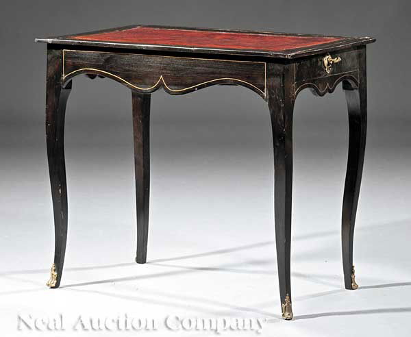 Ebonized and Brass Inlaid Table à Écrire: An Antique Continental Ebonized and Brass Inlaid Table à Écrire, 19th c., inset leather top, shaped apron fitted with an end drawer, cabriole legs ending in sabots, height 25 1/2 in., width 29 1/2 i