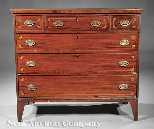 Federal Inlaid Mahogany Gentleman's Dresser: A Federal Inlaid Mahogany Gentleman's Dresser, early 19th c., rectangular top above three drawers, the center escritoire drawer with fall front writing surface and two small drawers, three graduated d