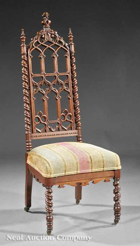 American Gothic Carved Walnut Hall Chair: An American Gothic Carved Walnut Hall Chair, mid-19th c., crocketed crest, tracery back, barley twist stiles, shaped seat rail, barley twist legs, casters