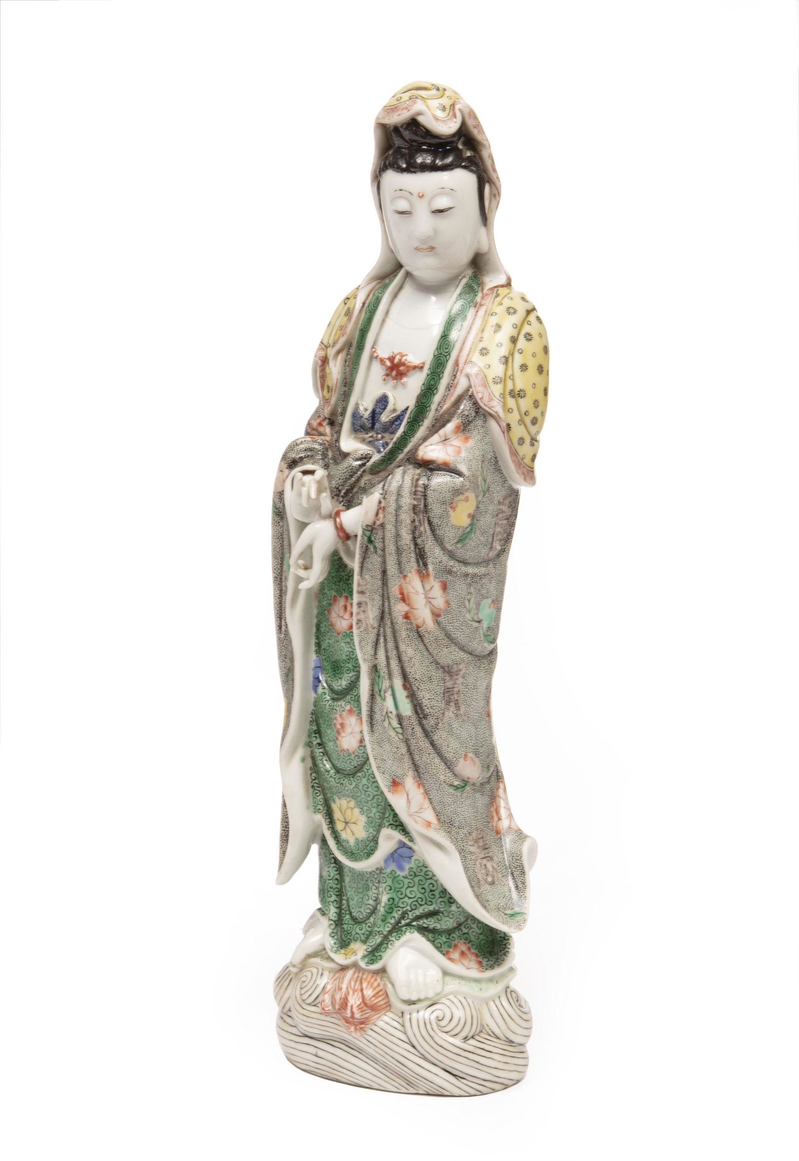 Chinese Famille Porcelain Figure of a Guanyin: Chinese Famille Verte Glazed Biscuit Porcelain Figure of Guanyin, Qing Dynasty (1644-1911), modeled standing on a mounded wave base wearing long robes open at chest, lotus bead necklace, bracelets and