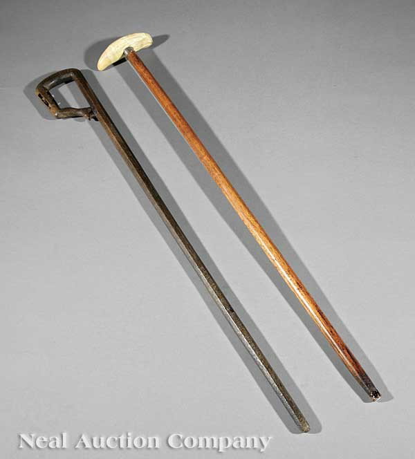 Two Canes: Two Antique Canes, 19th c., one with a whale tooth handle, the other carved with a lady-leg handle, enclosing two "mystery" balls