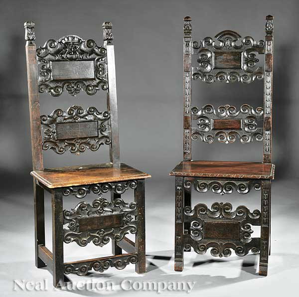 Near Pair of James I Carved Walnut Hall Chairs: A Near Pair of Antique James I Carved Walnut Hall Chairs, volute and paneled spats, one with mask, molded plank seats, blocked legs, volute stretchers