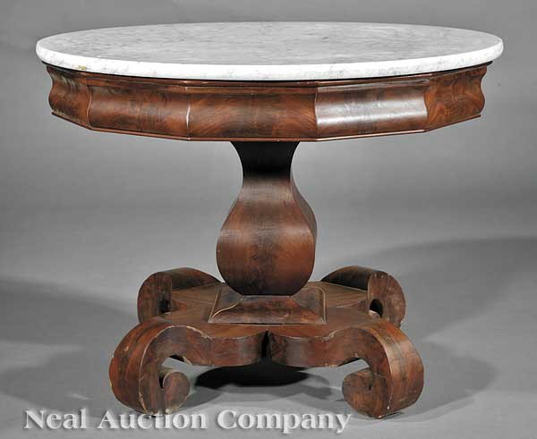 Late Classical Carved Mahogany Center Table: An American Late Classical Carved Mahogany Center Table, c. 1830, in the manner of J. & J.W. Meeks, New York, circular white marble top, molded and faceted frieze, bulbous stem, shaped plinth, scroll 