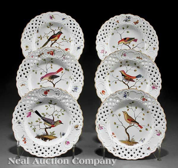 Six German Porcelain Ornithological Plates: A Set of Six Antique German Porcelain Ornithological Dessert Plates, blue crossed swords mark, decorated in the Meissen style with specimen reserves, reticulated borders with floral sprays, diameter 8