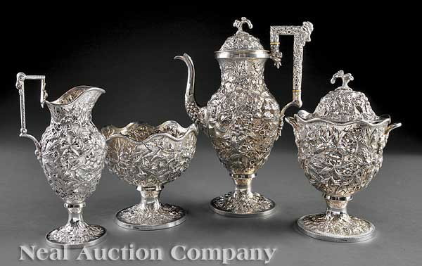 A. E. Warner Sterling Silver Repousse Tea Service: A Fine American Sterling Silver Repousse Tea Service, A. E. Warner, Baltimore, wc. 1864-1893, marked "Warner 11-2", comprised of a teapot, sugar, creamer and waste bowl, neoclassical vase forms with a