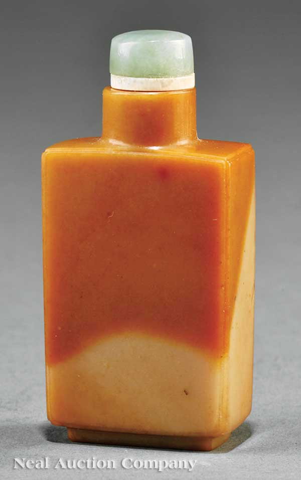 Chinese Chalcedony Agate Snuff Bottle: A Chinese Chalcedony Agate Snuff Bottle, 19th c., well-hollowed rectangular body with a cylindrical neck raised on rectangular foot ring, incised to one side with irises and rocks, inscribed, stopper,
