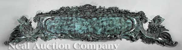Beaux Arts Patinated Bronze Signe de Magasin: A Beaux Arts Patinated Bronze Signe de Magasin, finely cast with floral sprays and scrolls, flanked with birds, the cartouche now void, height 27 1/2 in., width 112 in