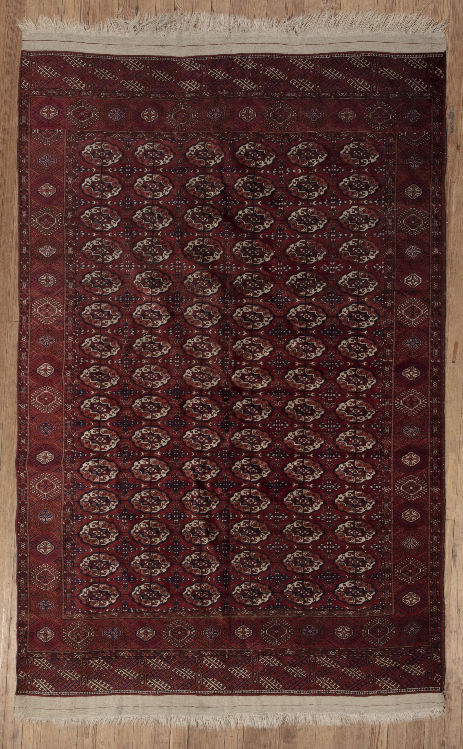 Tekke Turkestan Carpet: Tekke Turkestan Carpet , red ground, repeating guls, blue and ivory accents, 6 ft. 5 in. x 10 ft. 4 in.