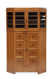 Jugendstil Inlaid Oak Vitrine Cabinet: Jugendstil Inlaid Oak Vitrine Cabinet, c. 1910, attr. to Bruno Paul, ebony-inlay, double-trapezoidal case, upper case with beveled glass doors, paneled lower case, conforming base, h. 62 in., w. 39