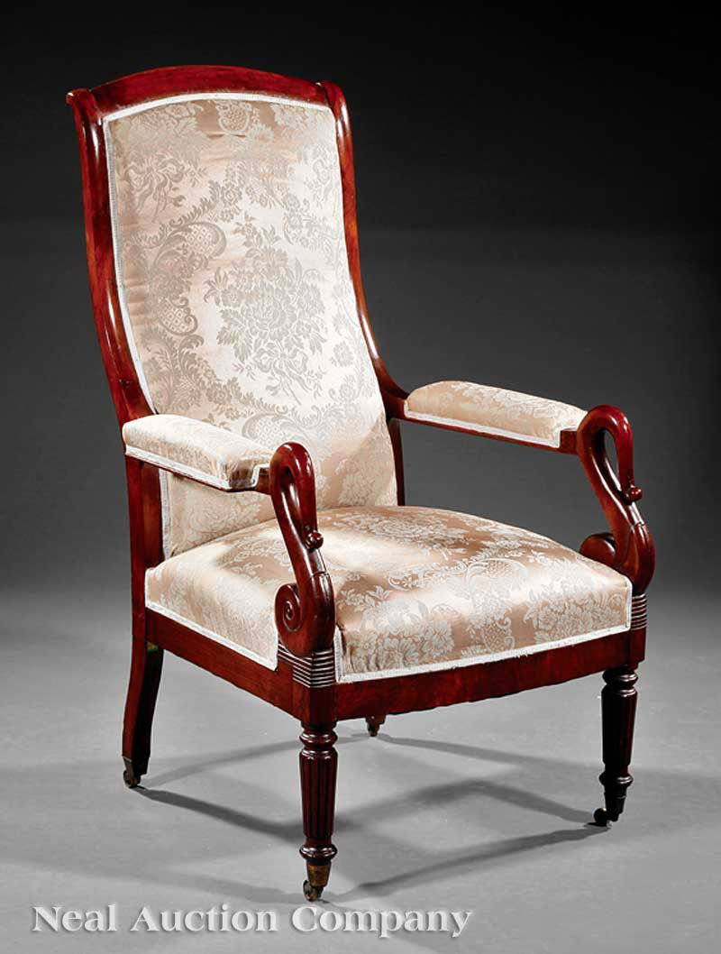 Mahogany Library Armchair, possibly Phyfe: An American Classical Mahogany Library Armchair, early 19th c., possibly Duncan Phyfe & Son, New York, tall scrolled padded back, padded arms with lappet carved scrolled supports, reeded and turned le