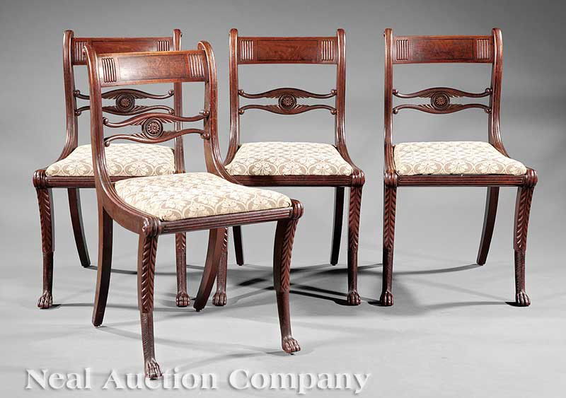 Carved Mahogany Side Chairs, attributed Phyfe: A Set of Four American Classical Carved Mahogany Side Chairs, c. 1815, New York, attributed to Duncan Phyfe, tablet crest, pierced medial rail, slip seat, saber legs, height 32 in Note: These chairs a