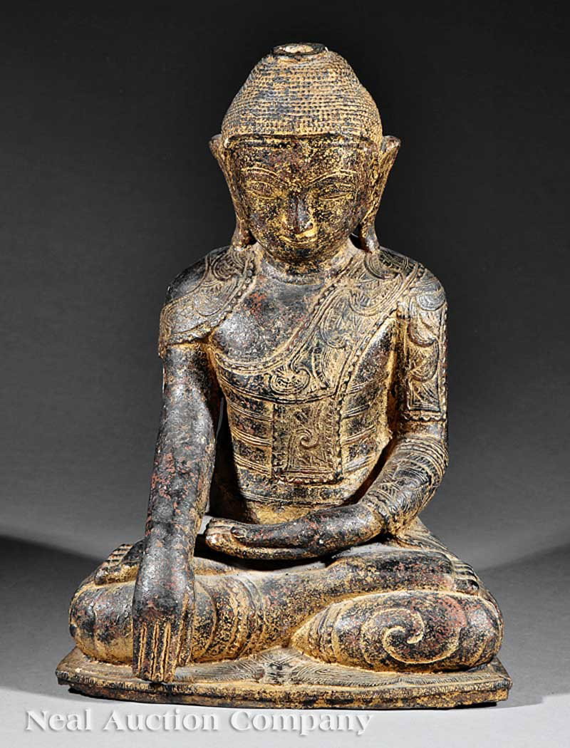 Burmese Gilt Lacquer Papier Mache of Buddha: A Burmese Gilt Lacquer Papier Mache Figure of Buddha, 19th c., modeled seated in vajrasana on a lotus pedestal base with his hands held in bhumishparsha mudra, the tightly knotted hair with a top knot