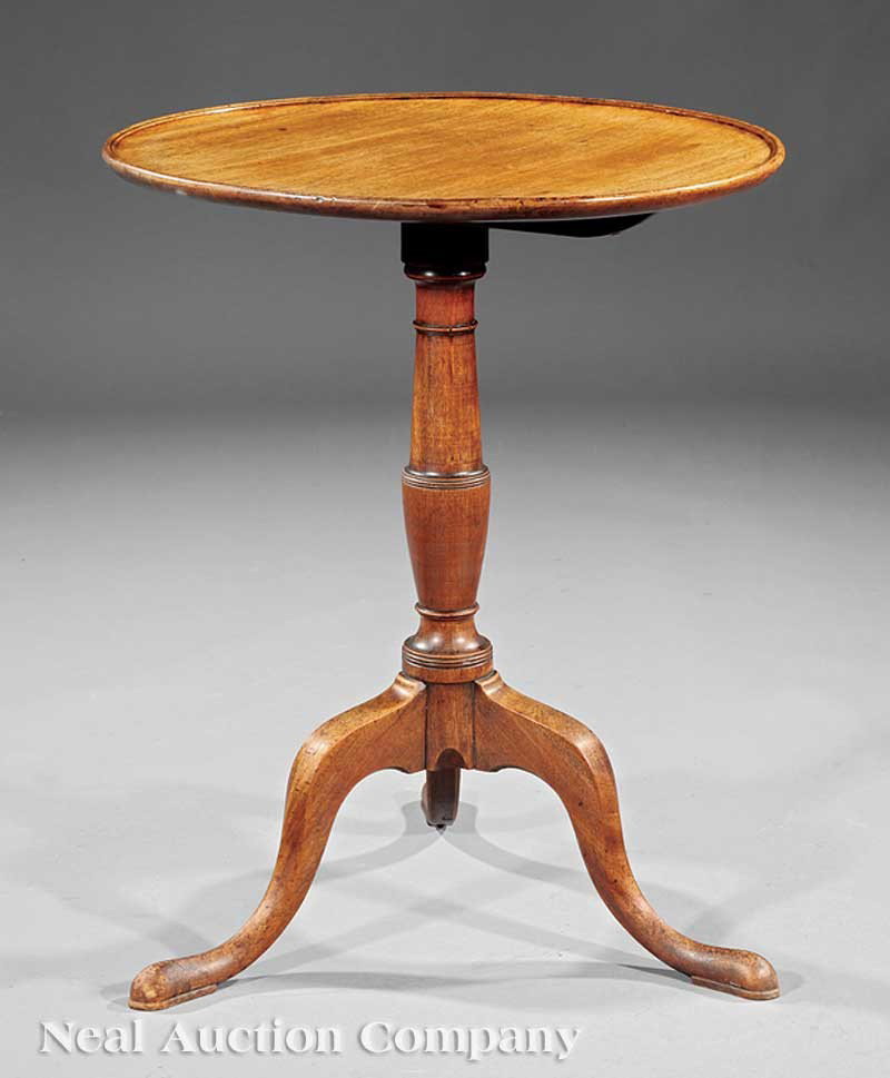 George III Carved Mahogany Tilt-Top Candlestand: A George III Carved Mahogany Tilt-Top Candlestand, c. 1760, dished top, vasiform stem, arched legs, slipper feet, height 29 in., diameter 23 in Provenance: Estate of Julia Badger, Grand Rivers, KY.